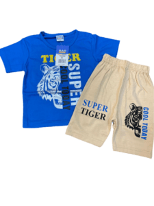 T-shirt shows a close-up of a boy’s blue t-shirt with a graphic of a tiger. The text “MAD TIER M.A.G SUPER SUPER TIGER COOL TODAY” is written in white above the tiger graphic. The boy is also wearing beige shorts., Boy's, Boy , fashion, kids, clothing, boys, blue, t-shirt, tiger, graphic, beige, shorts, summer, casual, playful